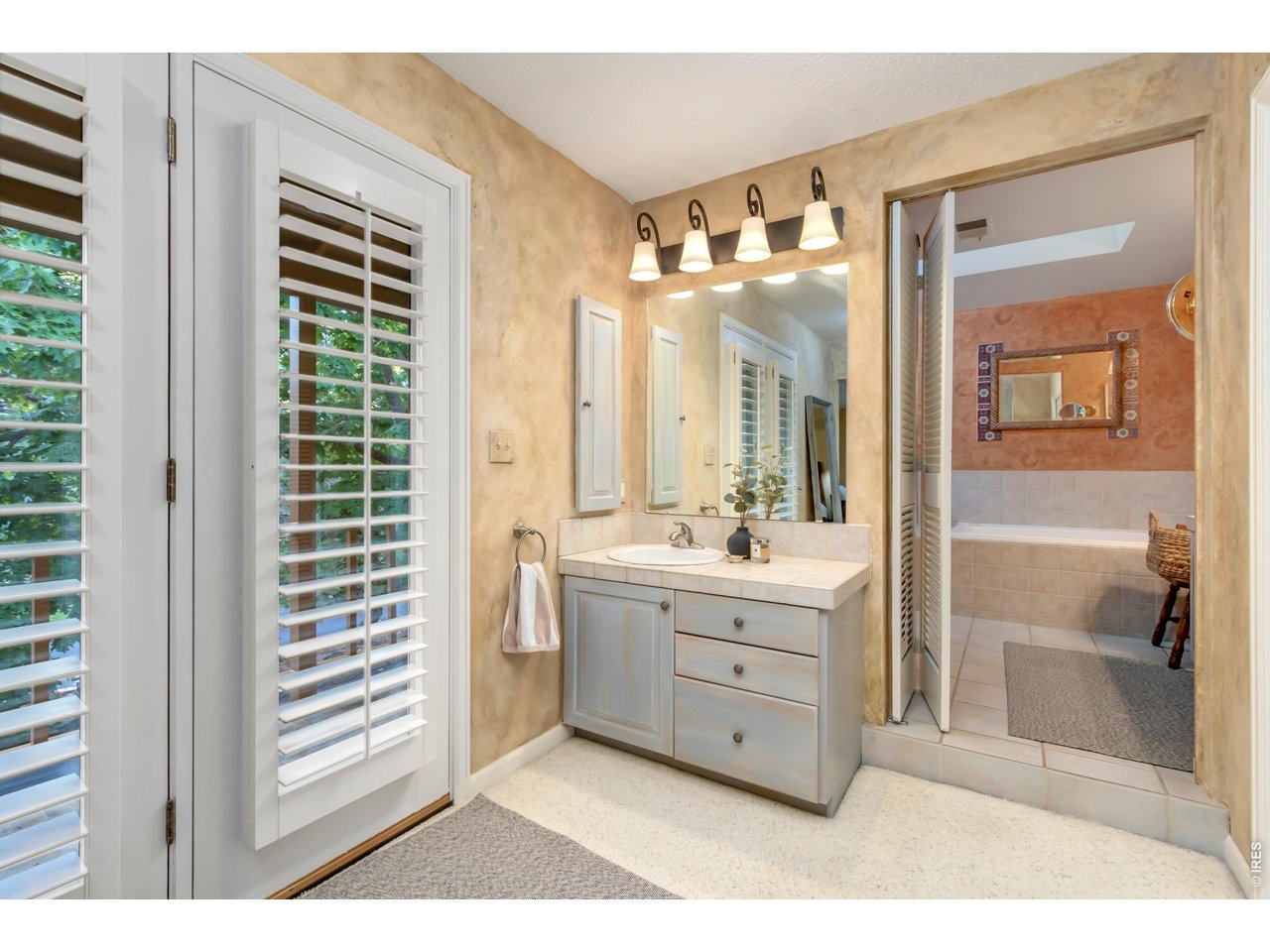 Property Photo 30 Spacious ensuite bath with dual vanities.