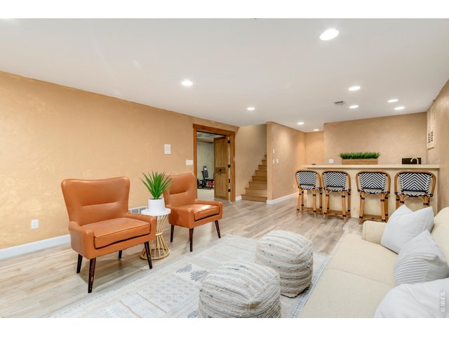 Property Photo 38 Cozy basement family room with fireplace and wet bar.