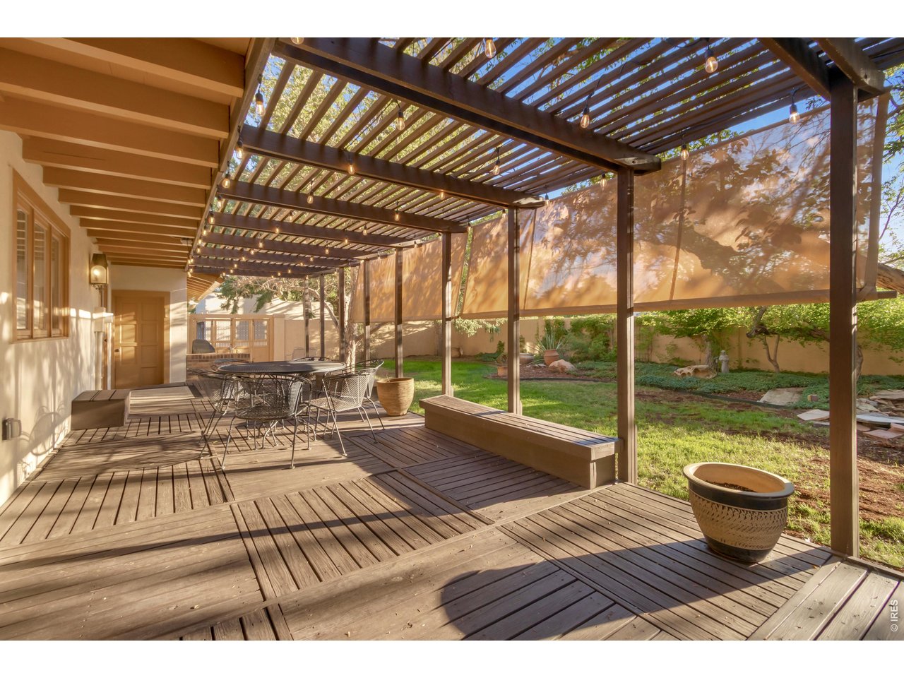 Property Photo 47 Covered backyard deck perfect for outdoor dining.