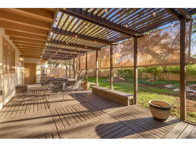 Property Photo 47 Covered backyard deck perfect for outdoor dining.