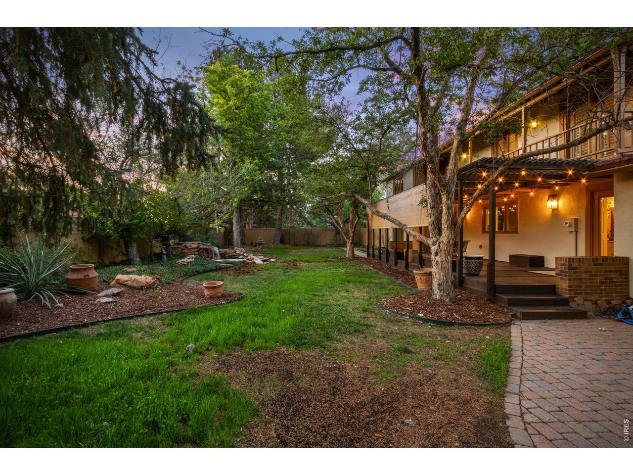 Property Photo 43 Stucco privacy wall and custom Spanish-style wood gates complete the outdoor oasis.