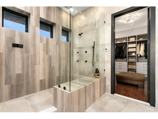 Property Photo 21 Custom Primary Waterfall Shower, Body Sprayers, programmable control system for water temp and personalized settings