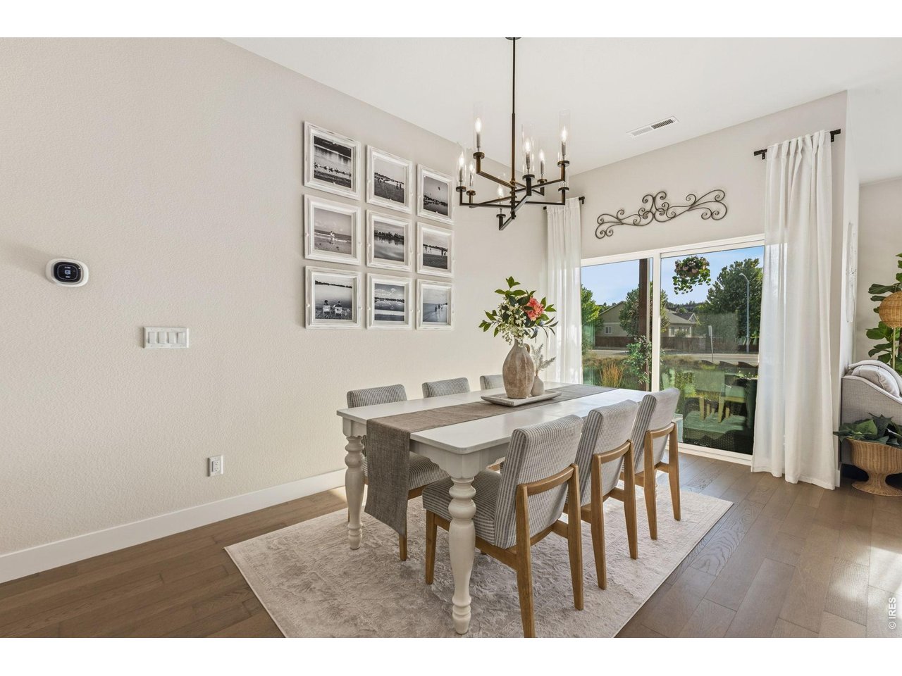 Property Photo 5 Spacious dining area offers seamless indoor and outdoor entertaining.