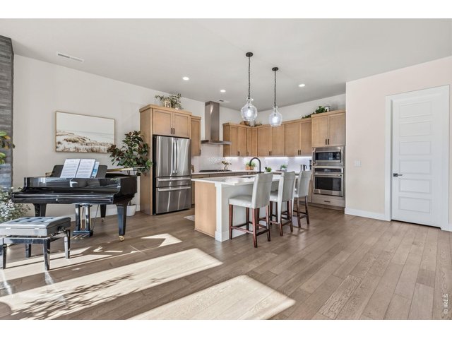 Property Photo 9 Beautiful engineered hardwood flooring flows through the main living areas.