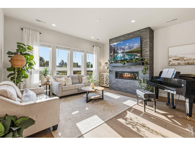 Property Photo 14 Custom fireplace mantle adds character and style to the living space.