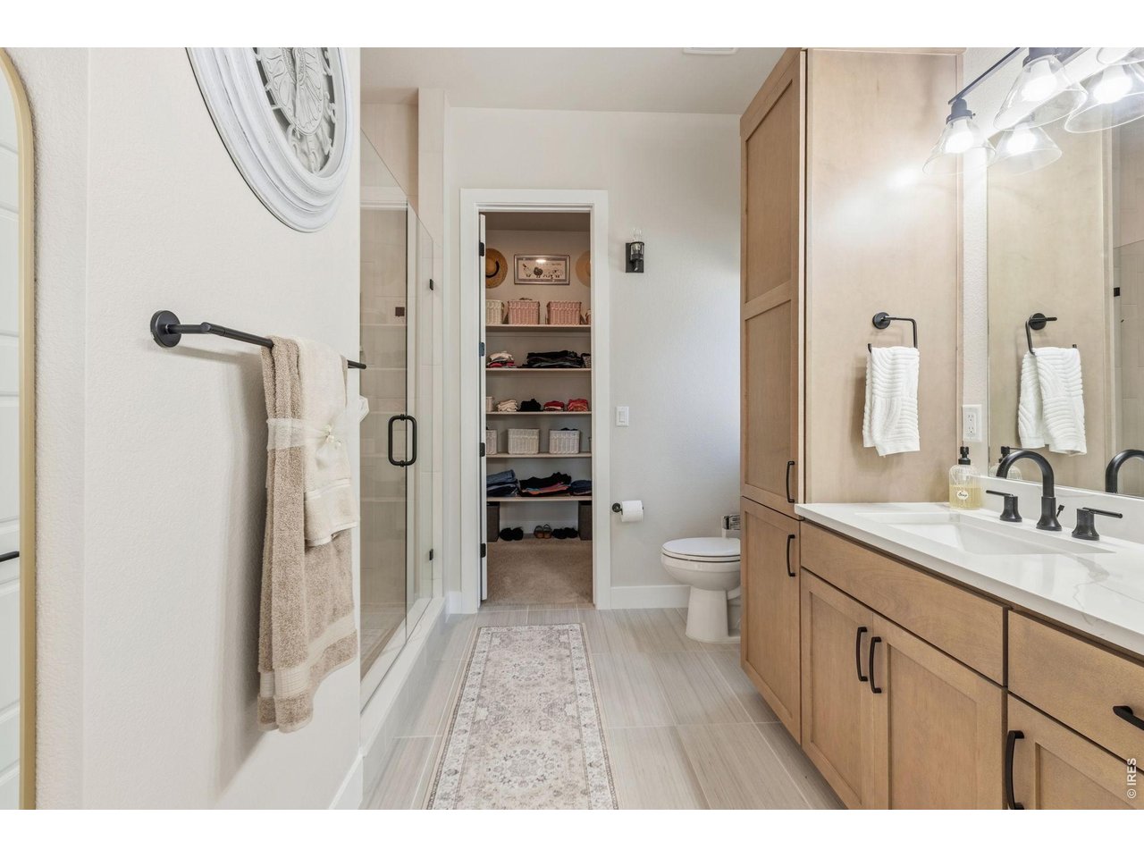 Property Photo 19 Spa-inspired primary bathroom offers everyday luxury. Large walk-in closet offers exceptional storage.