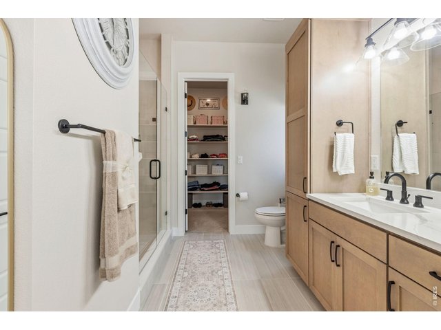 Property Photo 19 Spa-inspired primary bathroom offers everyday luxury. Large walk-in closet offers exceptional storage.