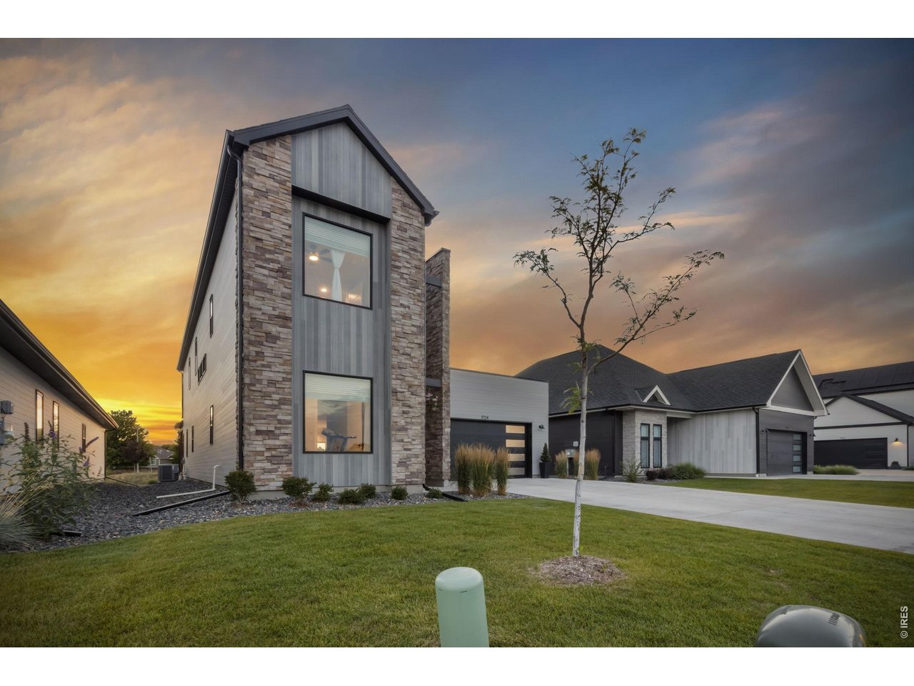 Property Photo 2 Contemporary architecture and beautiful curb appeal create a memorable first impression.