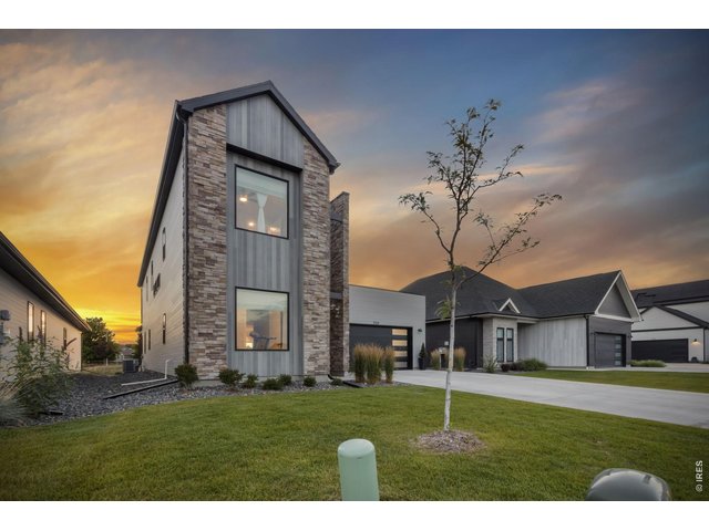Property Photo 2 Contemporary architecture and beautiful curb appeal create a memorable first impression.