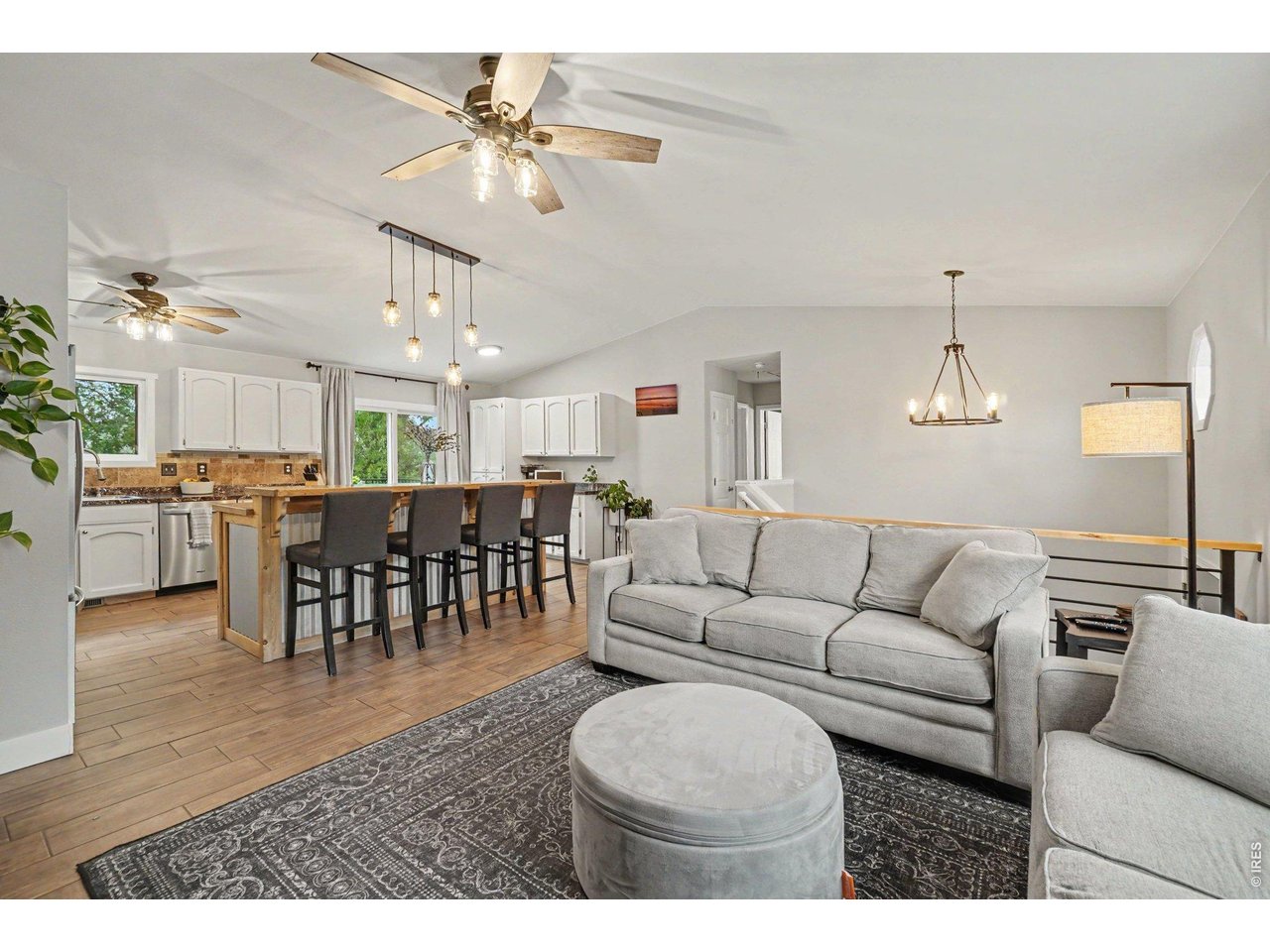 Property Photo 5 Fluid transition from the main living area directly into the kitchen, ideal for hosting.