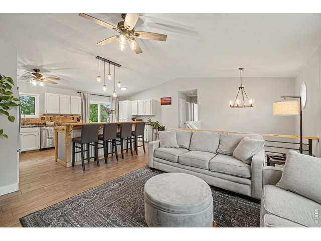 Property Photo 5 Fluid transition from the main living area directly into the kitchen, ideal for hosting.