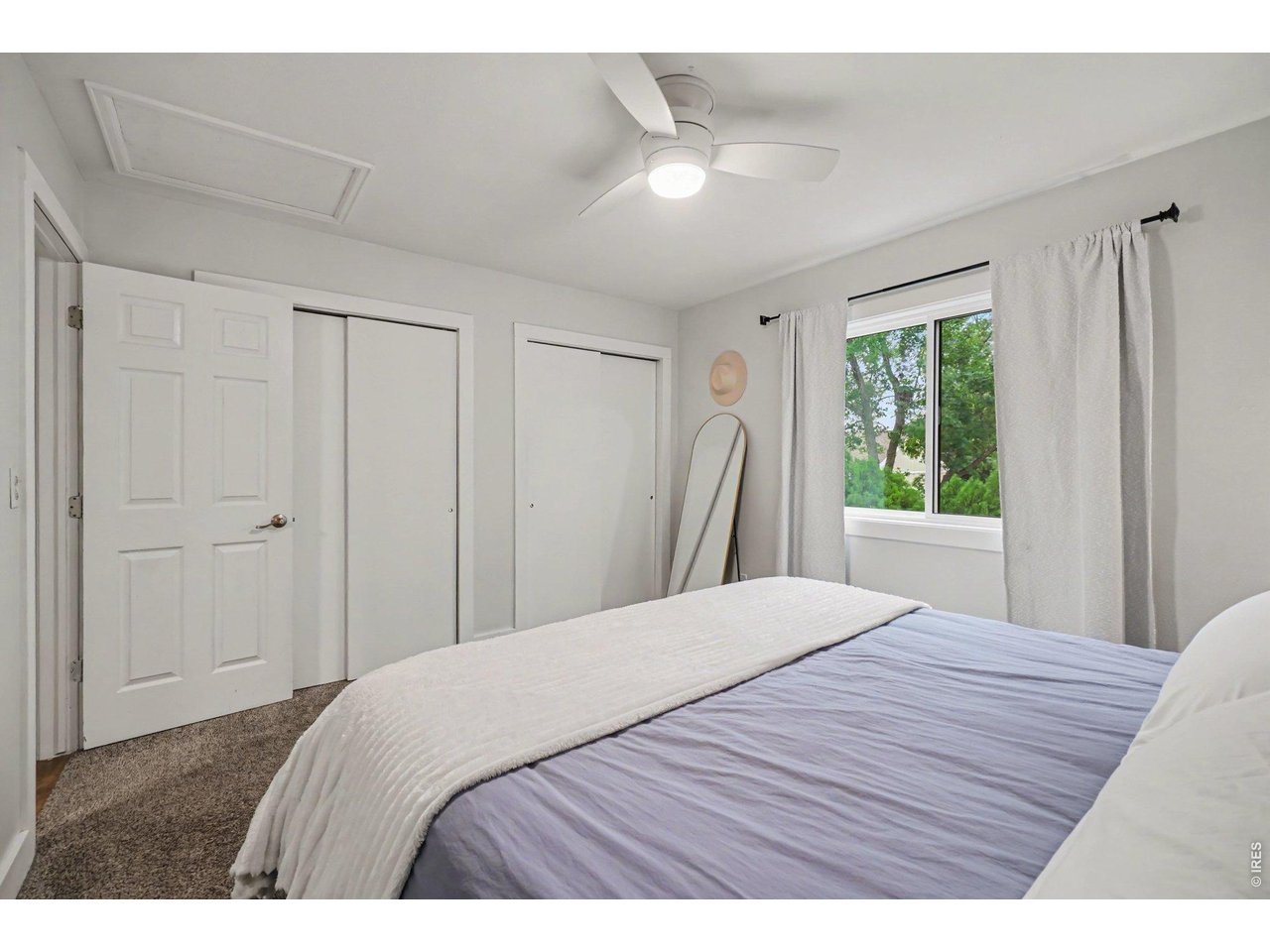 Property Photo 15 Practical bedroom design boasting dual sliding closets to maximize your wardrobe organization.