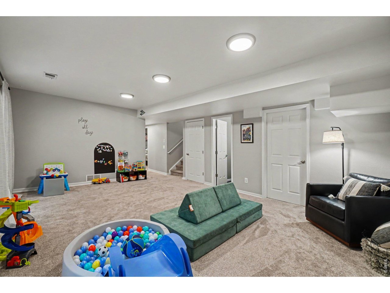 Property Photo 21 Showcases the impressive scale of the main rec area, offering endless configuration options for secondary living and entertainment.