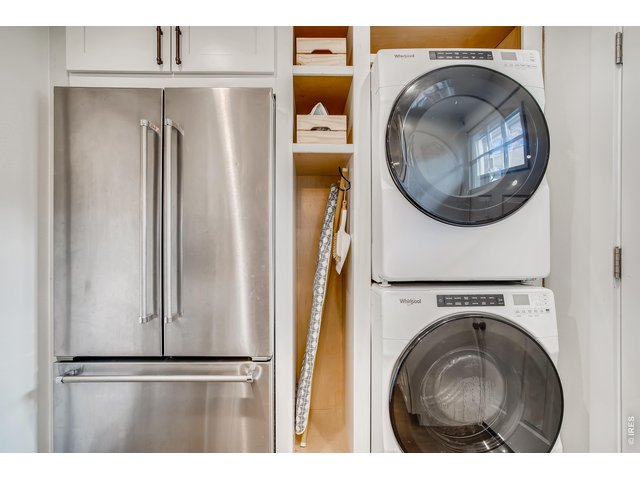Property Photo 11 Stackable washer/dryer and fridge