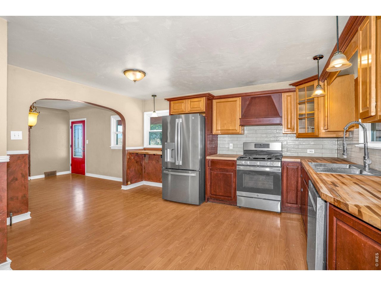 Property Photo 2 Kitchen With new Butcher Block Counters and updated tile backsplash