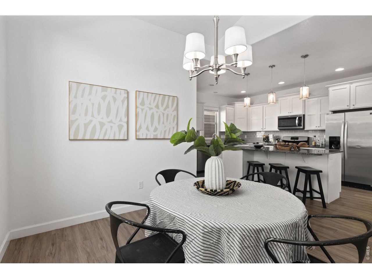 Property Photo 6 Great Space for Entertaining with LVP Flooring Throughout the Main Living Area