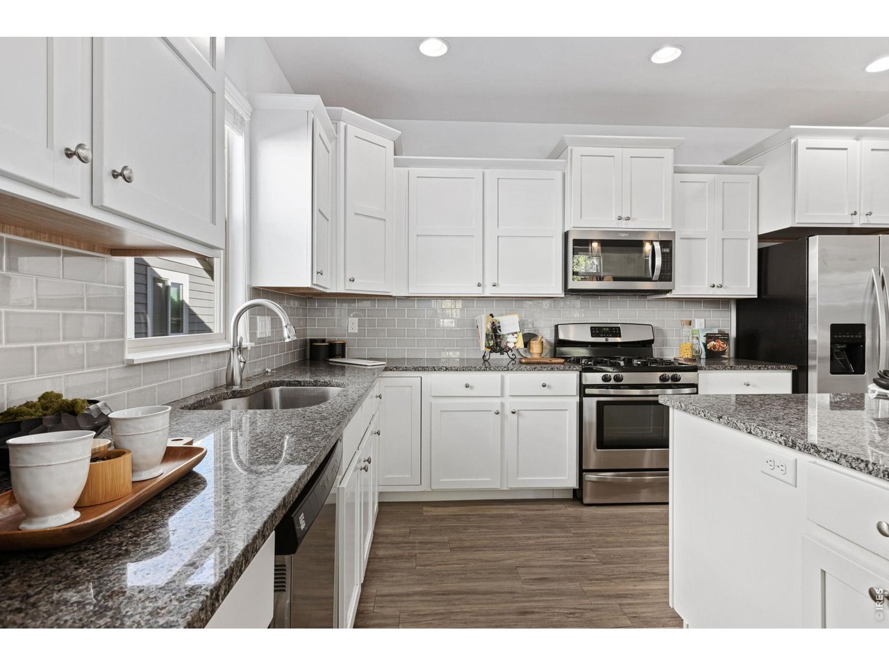 Property Photo 8 Granite Counters and Stainless Steel Appliances as well as Generous Cabinet Space and a Pantry
