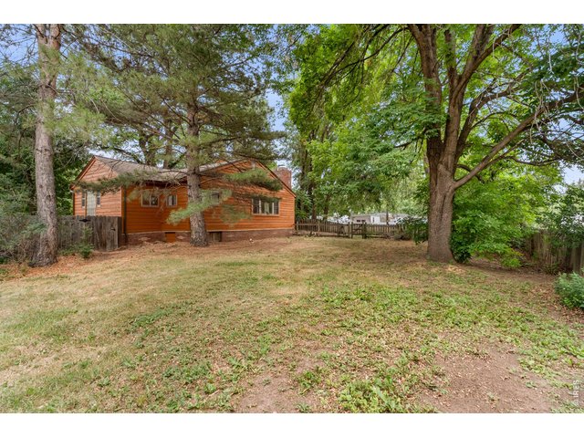 Property Photo 7 West Side Front with Mature Shade Trees