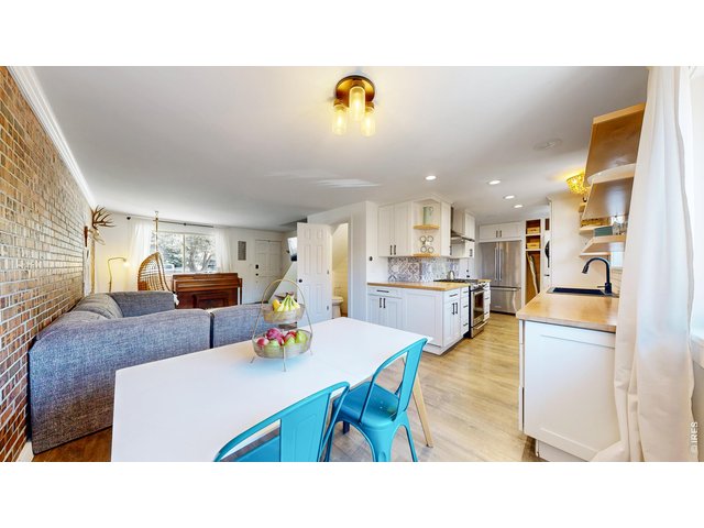Property Photo 5 Dining space with a peak into the kitchen