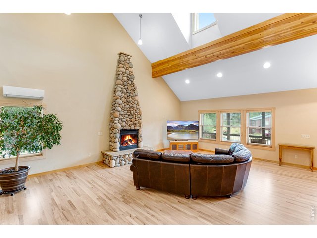 Property Photo 14 Stone gas fireplace to warm the space in the colder months.