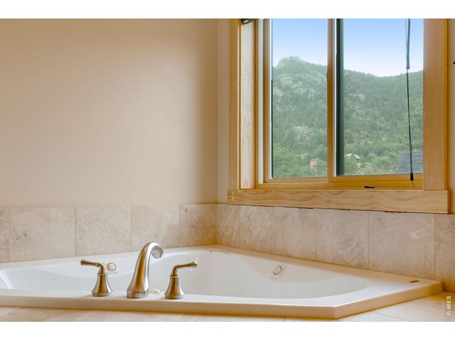 Property Photo 27 Enjoy a bubble bath while taking in mountain views.