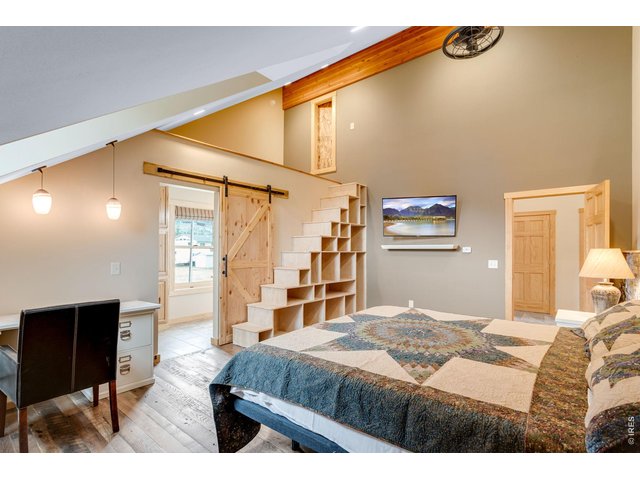 Property Photo 34 Custom stairs that go to the attic.