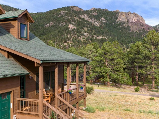 Property Photo 7 Relax on the covered front porch or enjoy your morning coffee taking in views of Longs Peak and Twin Sisters.