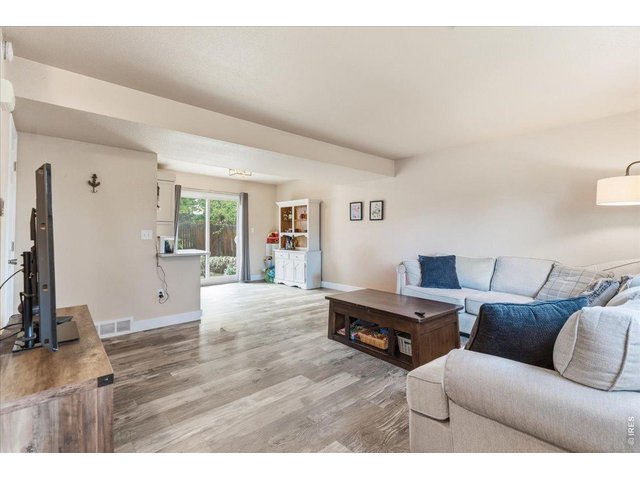 Property Photo 7 Step inside to the spacious living room