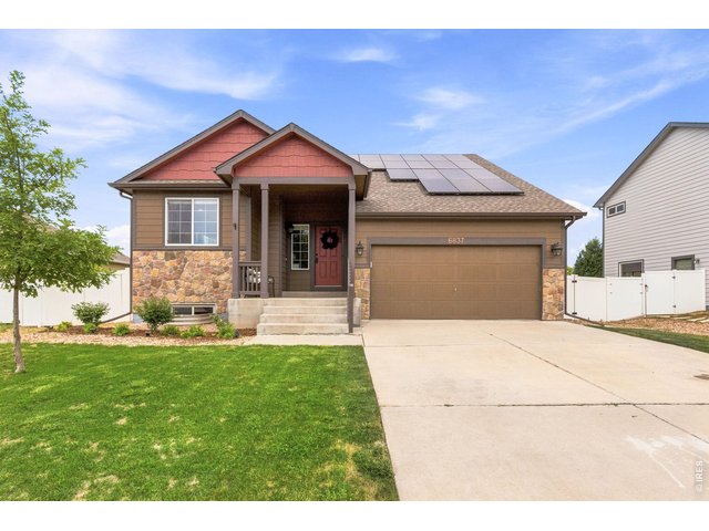 Property Photo 1 Welcome home! Charming curb appeal, and energy-efficient solar panels help make this home as practical as it is inviting.
