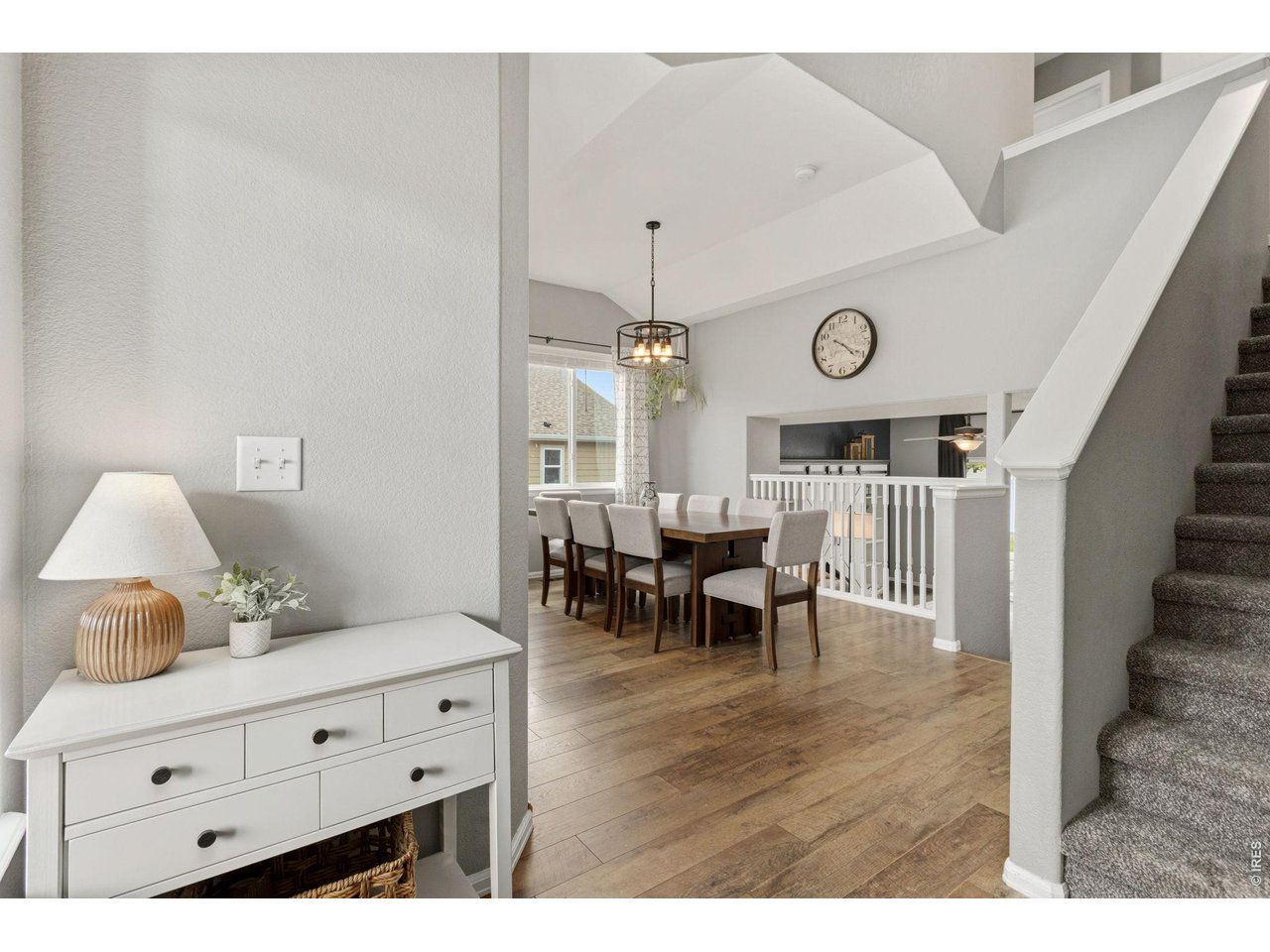 Property Photo 3 Step inside to soaring ceilings, beautiful flooring, and a bright, open feel that carries throughout the home.