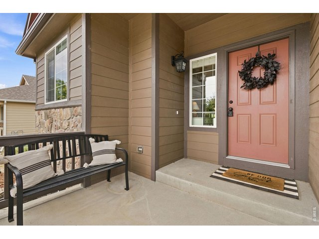 Property Photo 2 A welcoming covered front porch. Just in case we ever get rain again!