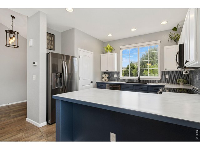 Property Photo 7 Plenty of counters offering generous prep space, seating, and room for guests to gather.