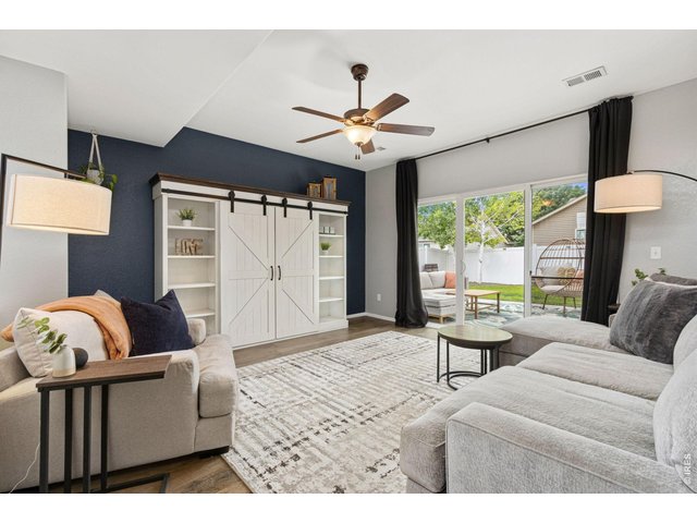 Property Photo 8 This inviting living room offers plenty of space to gather and unwind.