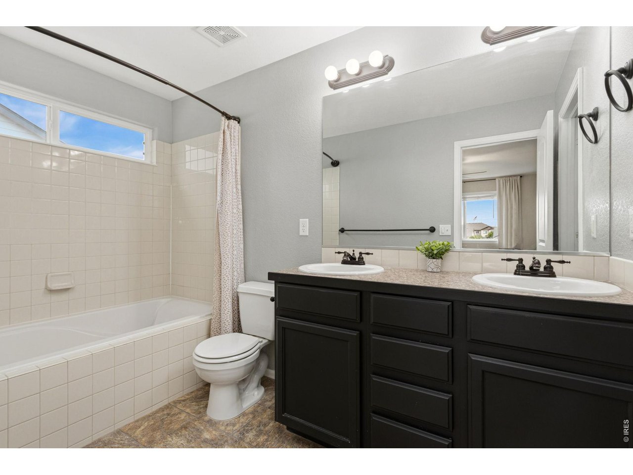 Property Photo 15 The ensuite with double vanities and a large soaking tub will not disappoint.