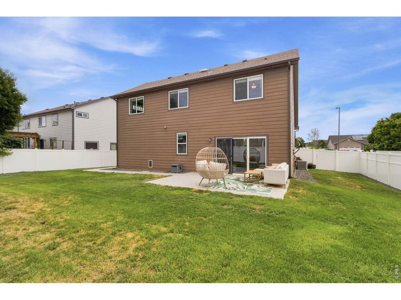 Property Photo 23 Whether you're hosting BBQs, playing catch, or simply relaxing on the patio, this fully fenced yard offers plenty of room to enjoy.