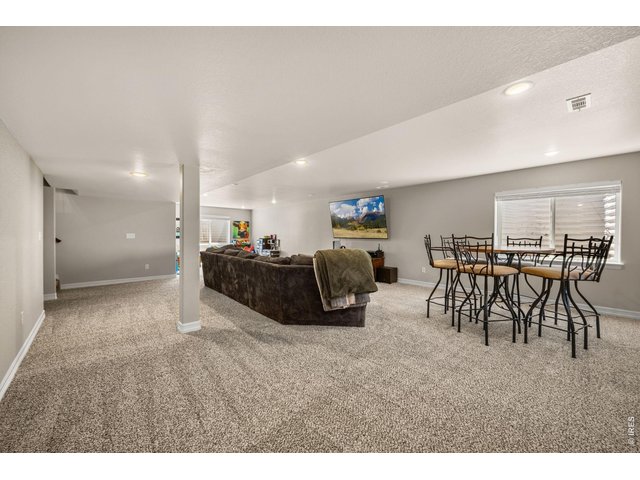 Property Photo 24 Lots of room to play or entertain in the basement family room