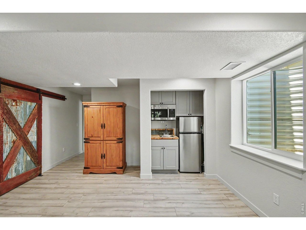 Property Photo 24 Kitchenette and barn door made out of reclaimed wood and metal