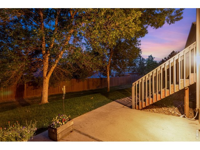 Property Photo 36 Backyard Trex deck with an additional storm door