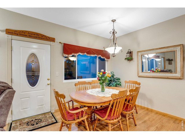 Property Photo 10 Dining room with chandelier and patio access