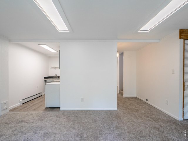 Property Photo 36 Basement family room looking into kitchenette