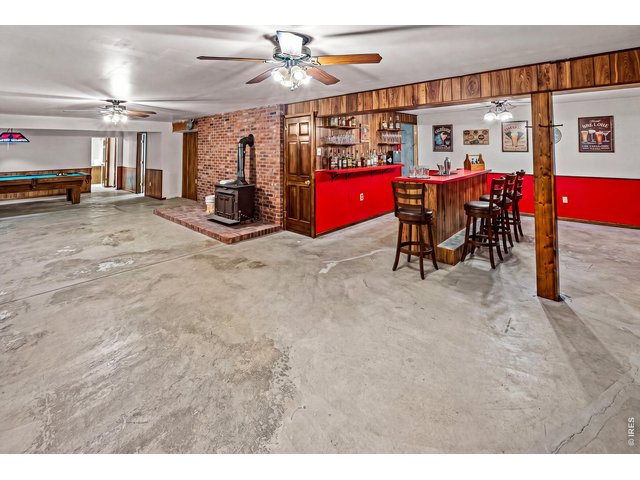 Property Photo 29 Huge Basement- somewhat finished waiting for final touches to be complete. Bar and Rec room Area