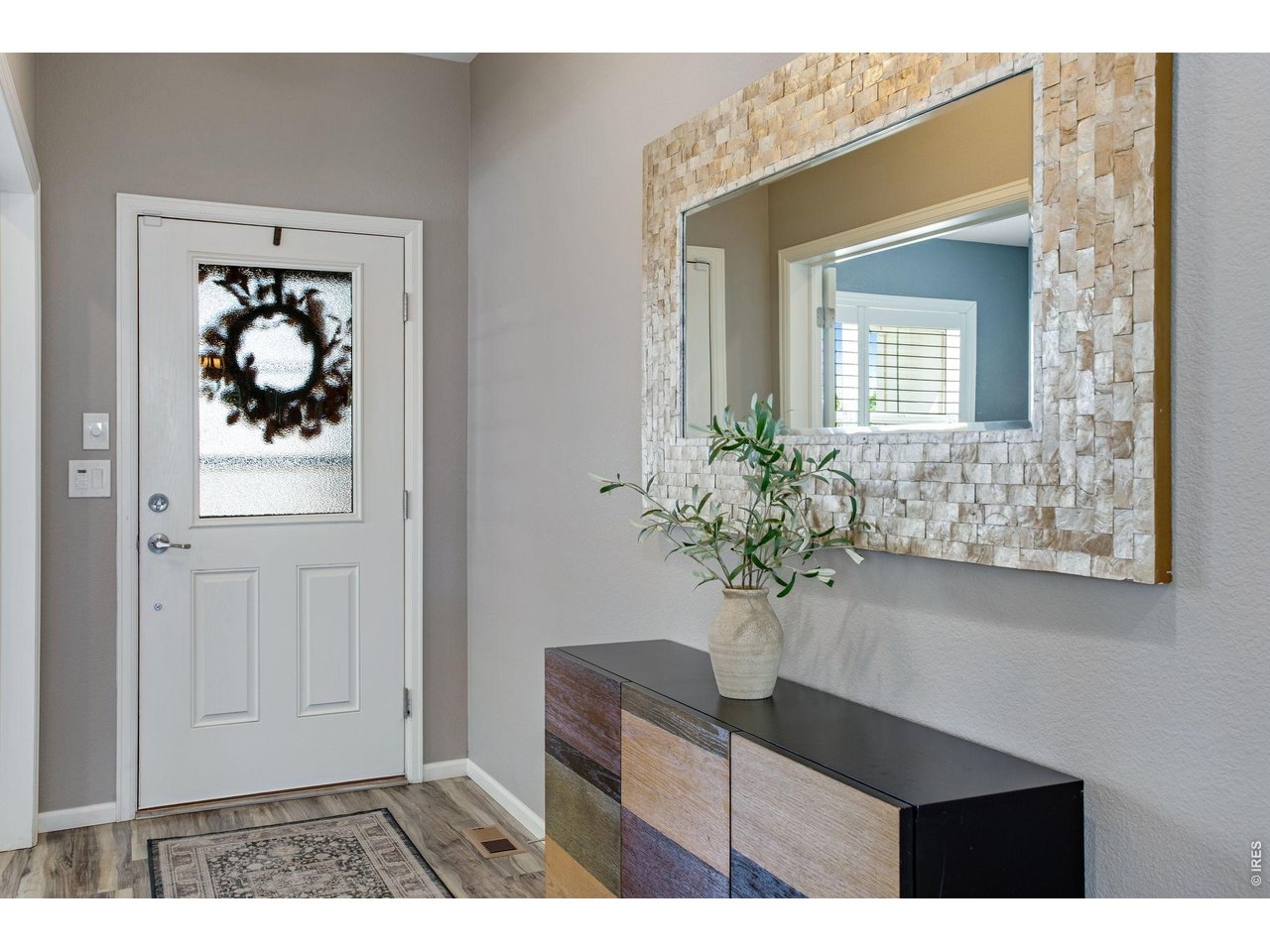 Property Photo 9 Welcome! Warm neutral interior paint, low maintenance wood laminate flooring.