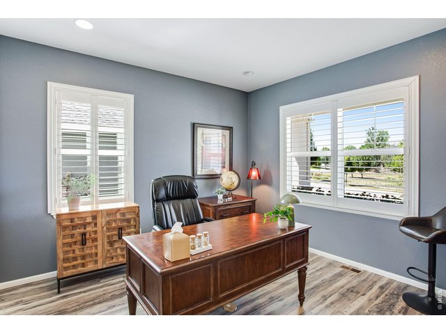 Property Photo 14 South facing sunny in home office conveniently off the entry - with plantation shutters, desk can stay - see extensive list of inclusions.