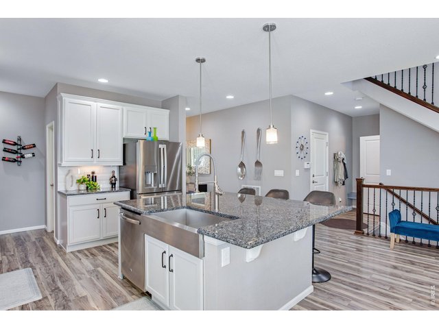 Property Photo 11 Stunning Stainless appliances, newer french door fridge 2025! Loaded with cabinetry & countertop space. Full tile splash!