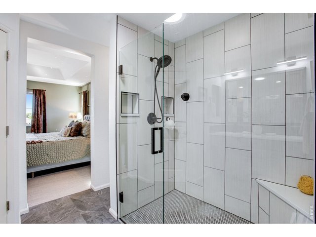 Property Photo 36 Amazing walk-in shower and poured pan floor - large framless doors and cool down seat!