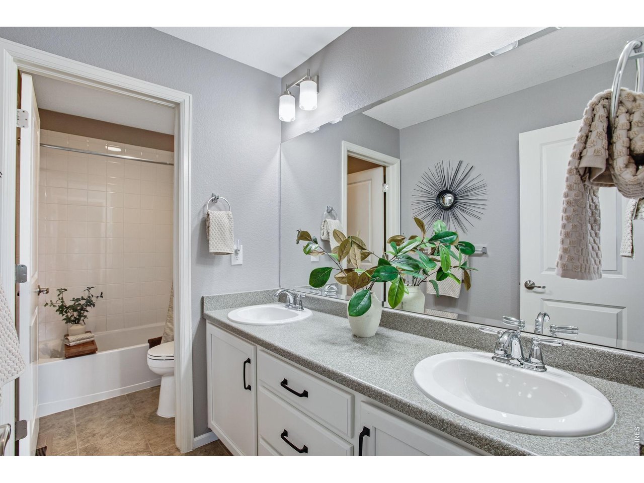 Property Photo 39 In pristine condition, lightly lived in - secondary bathroom - dual vanities and separate shower and toilet area.
