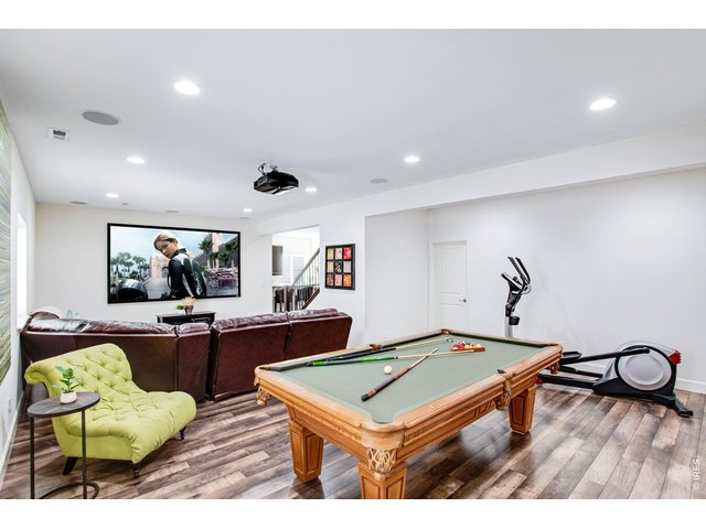 Property Photo 42 Watch your favorite movies & games! Comes with a ceiling mounted sony projector, screen, sectional and pool table!