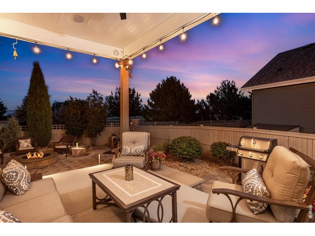 Property Photo 31 Another angle - backyard and covered patio. Firepit, waterfall feature!