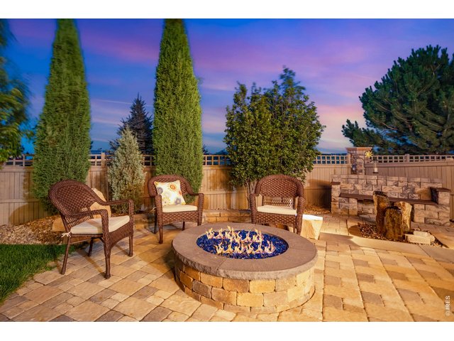 Property Photo 6 A backyard entertainer's "Haven" oversized gas firepit, plenty of room for relaxing and enjoying our cooler summer evenings! Full custom privacy fence, painted in 2022.