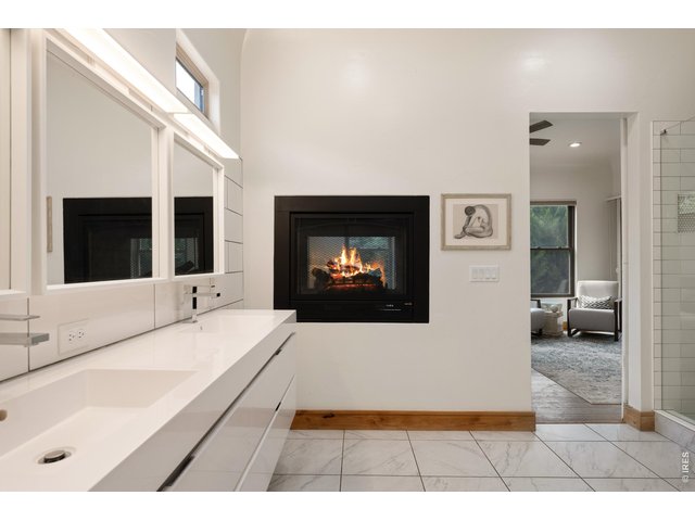 Property Photo 19 Full Primary Bath w/ Large Walk-In Closet with Custom Built-In's